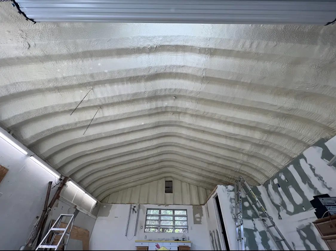 Spray polyurethane foam applied to the underside of a metal roof deck in DeSoto